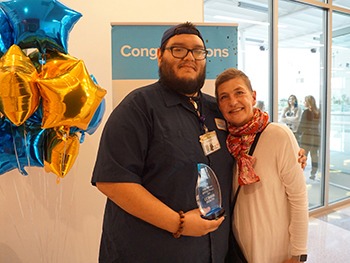 A cut above: EVS custodian loses his locks to support Burn Unit patient